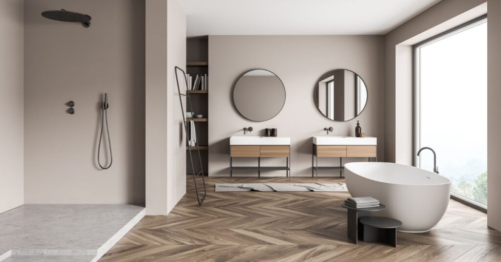A contemporary bathroom featuring a sleek bathtub and a glass-enclosed shower area.