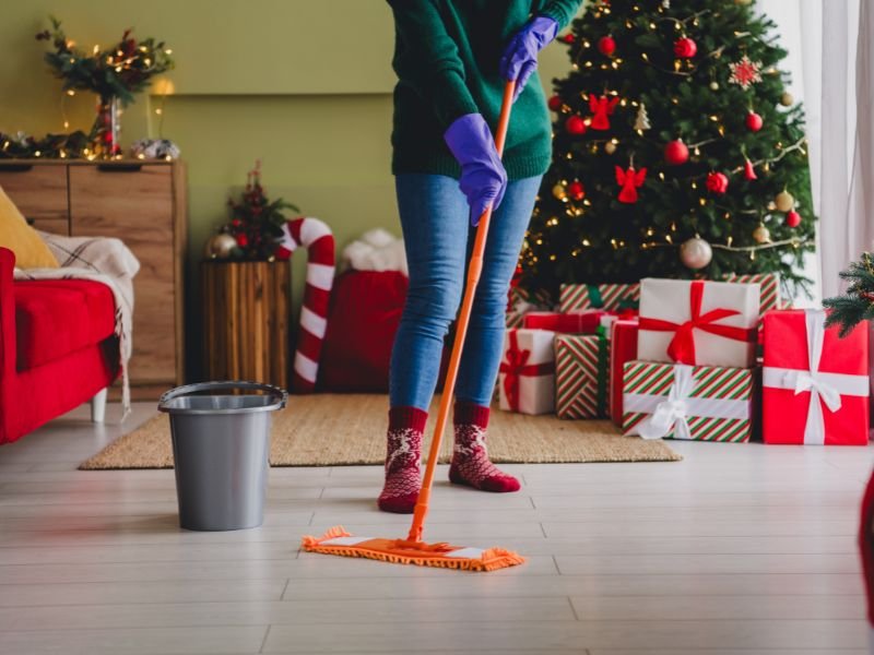 lady cleaning floor during the holidays