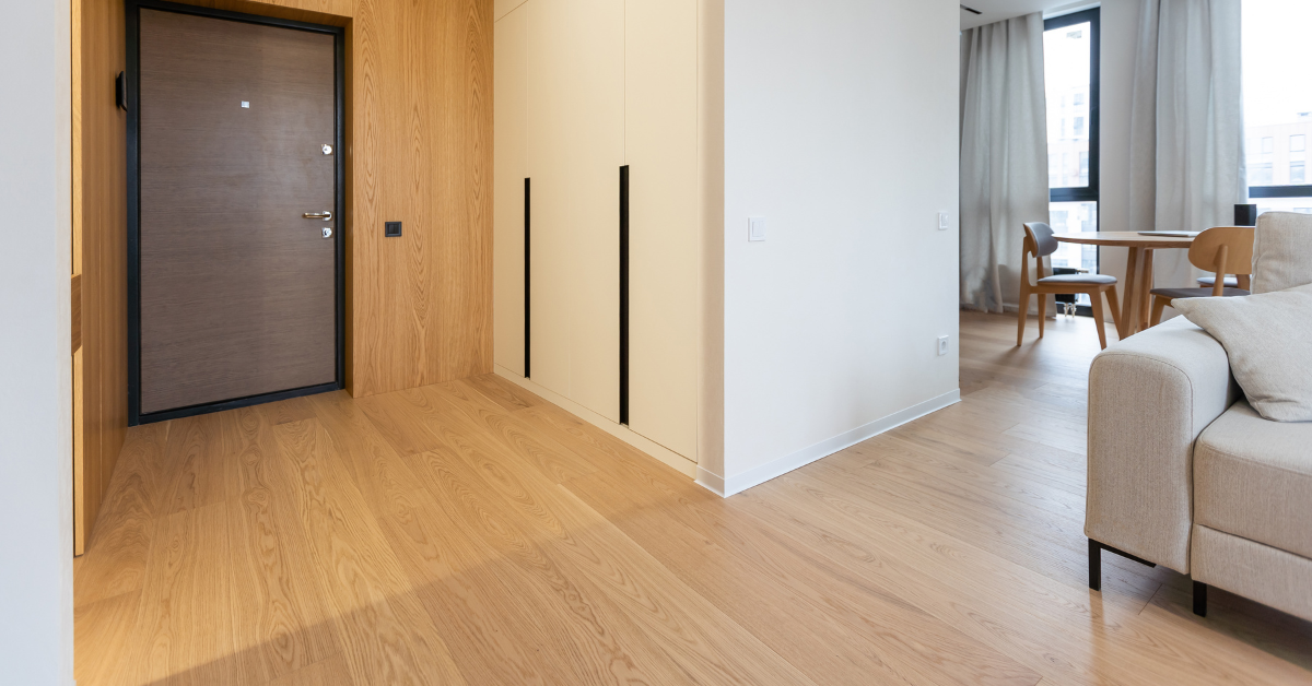 An inviting room showcasing a couch alongside a door, highlighting a relaxed living space.